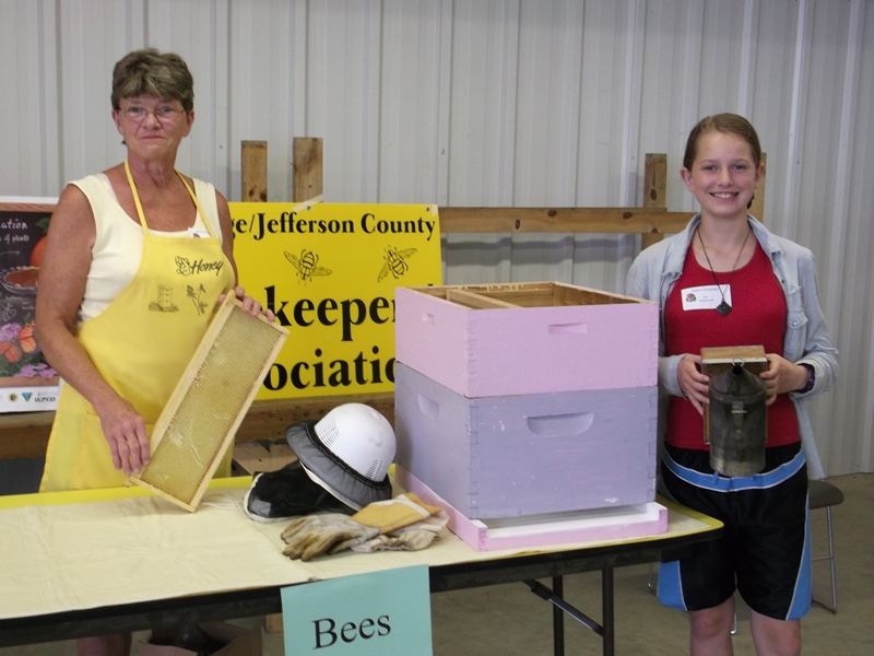 Members giving a presentation on beekeeping.